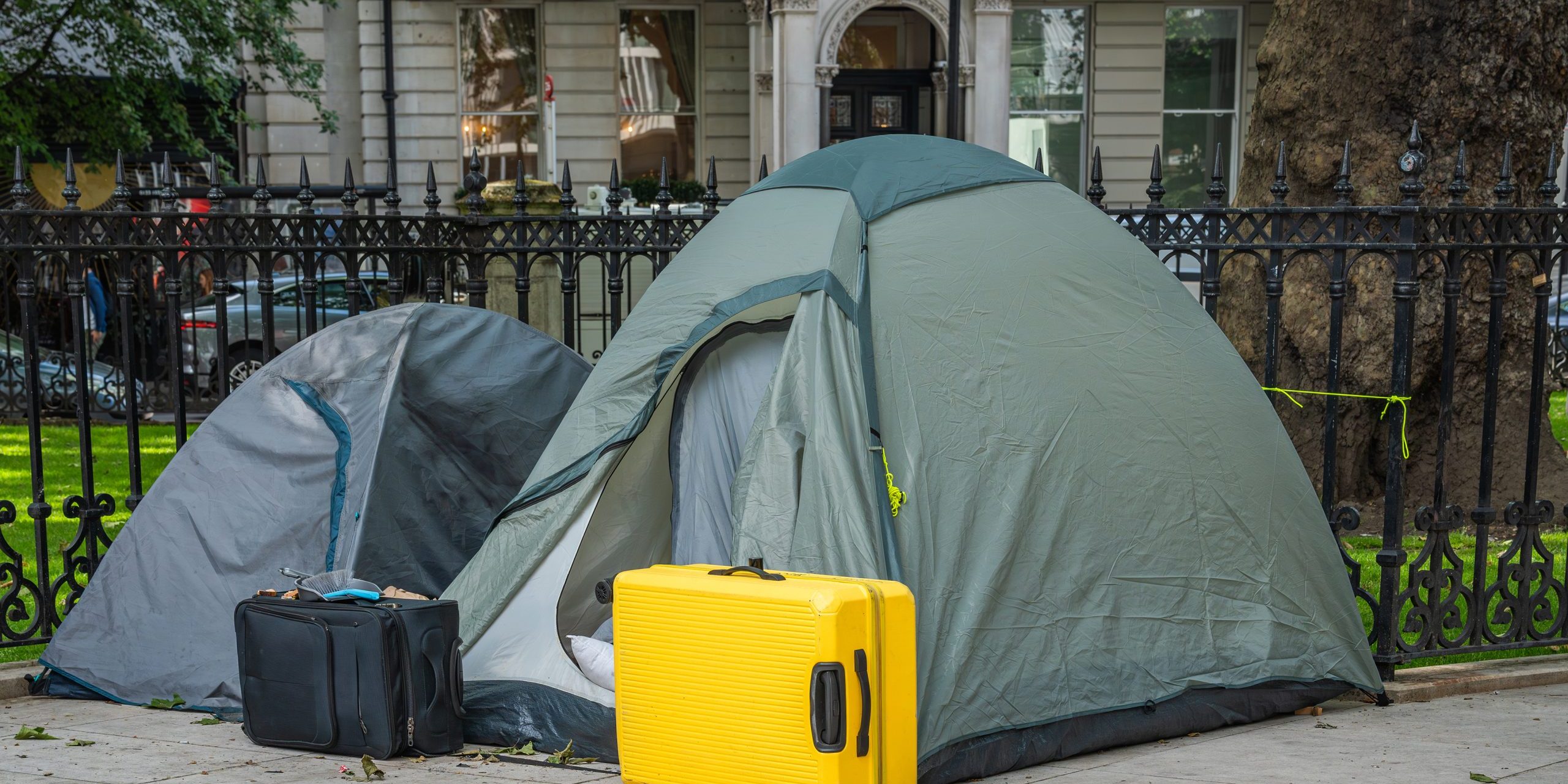 Homelessness in big cities. Tourists or homeless people sleeping in a tents in a streets of London